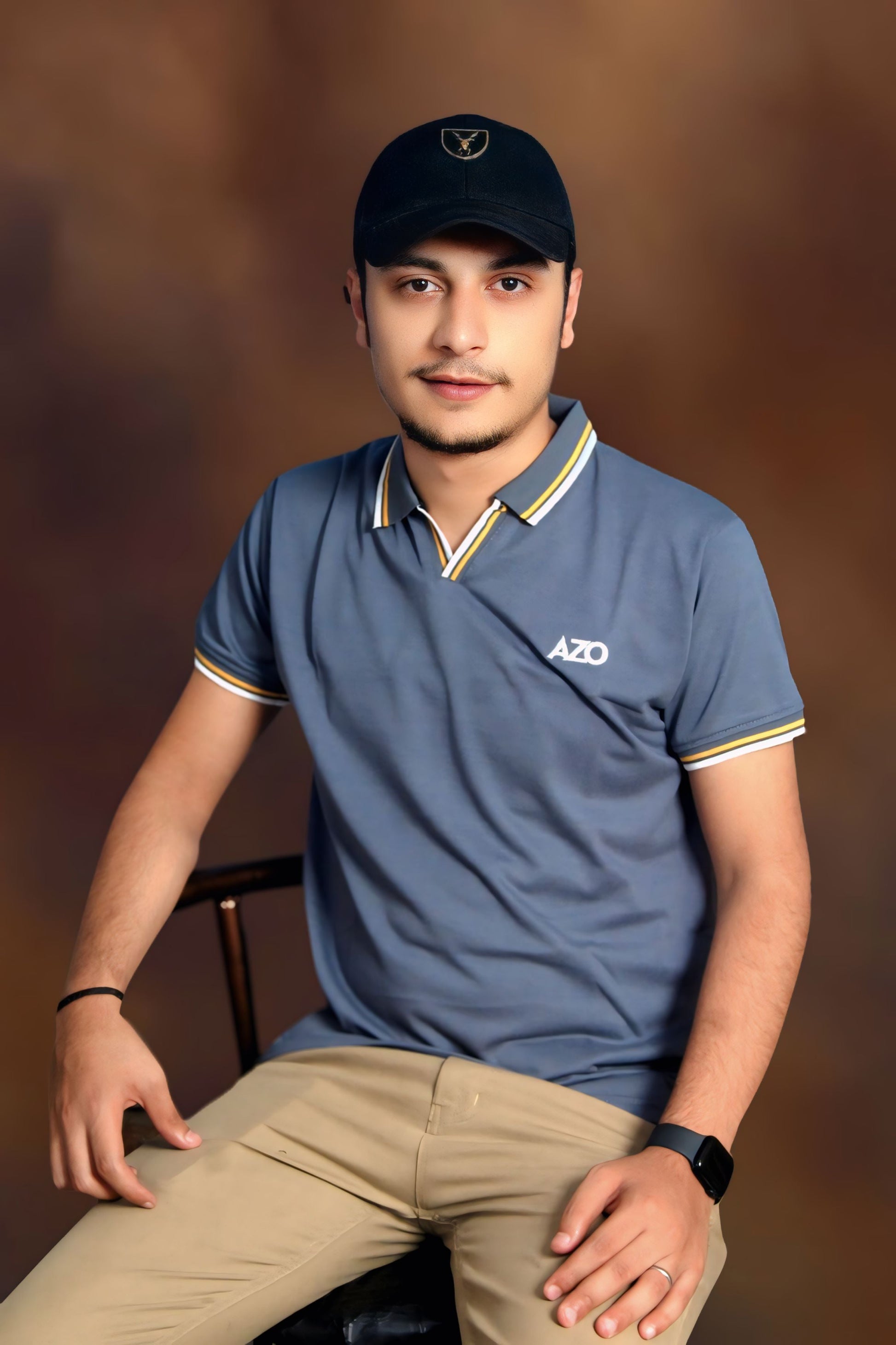 AZO Signature Polo - Steel Grey, seated portrait